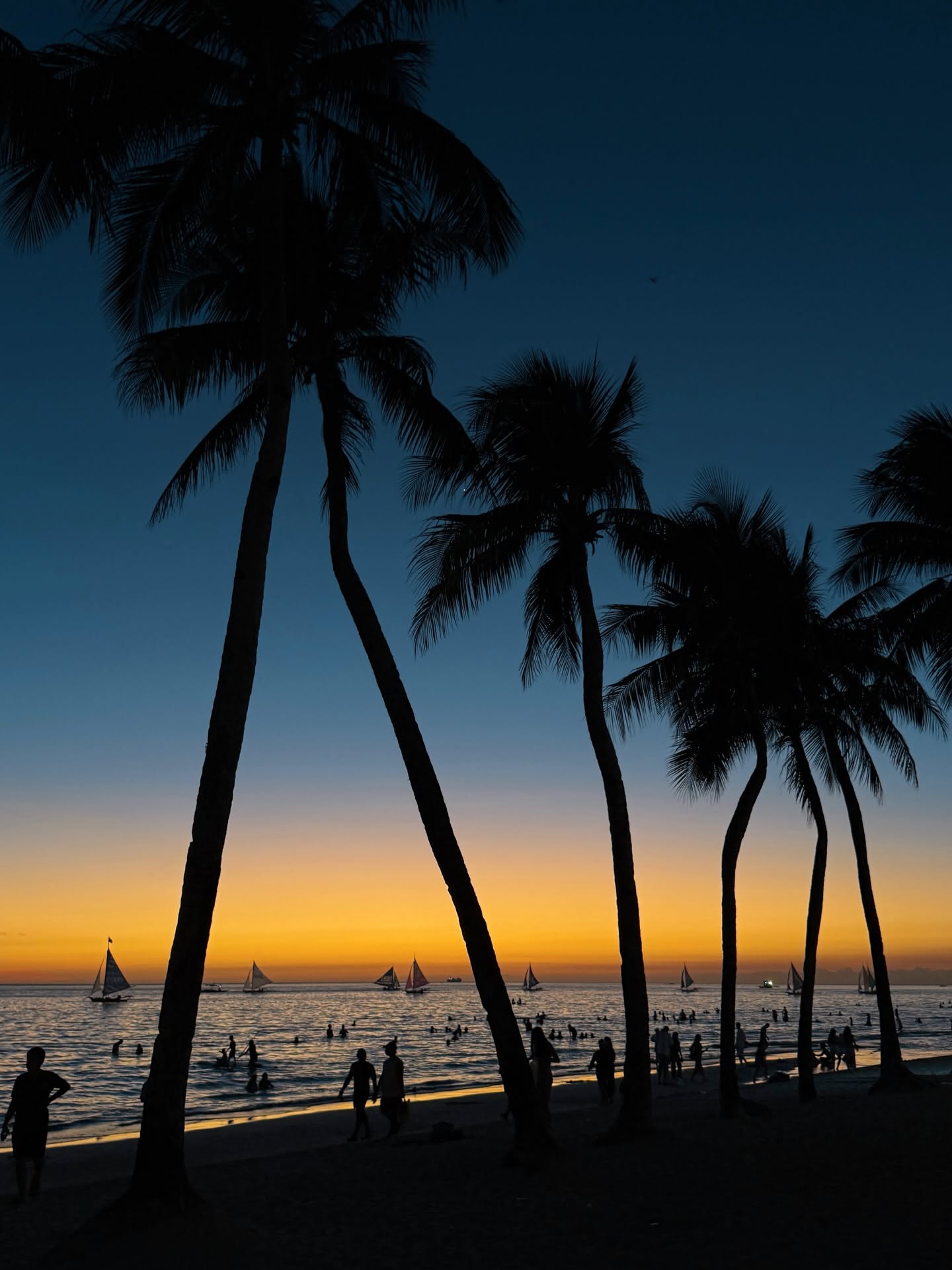 Christina's elegant beachfront dining at sunset